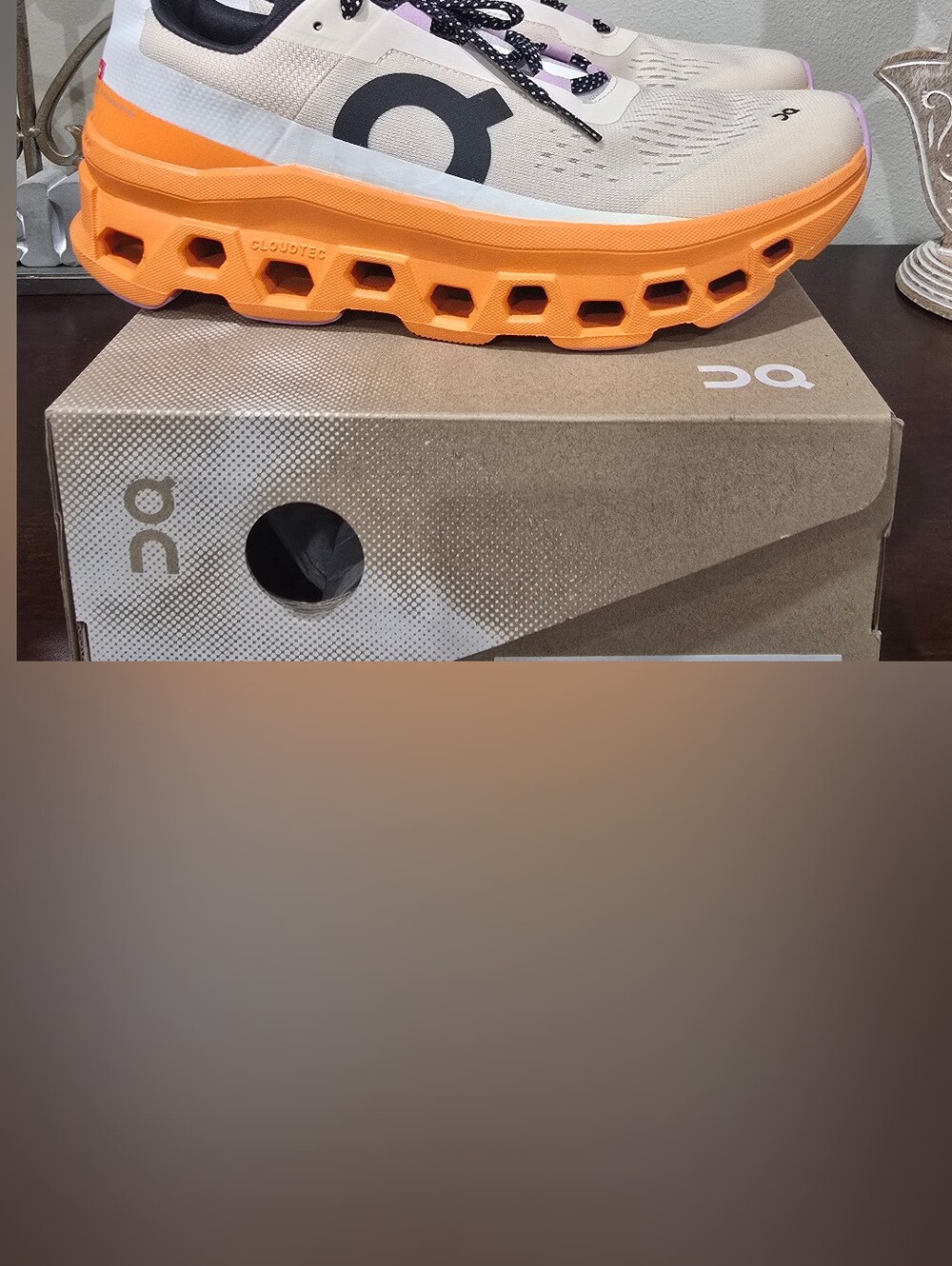 On Running Cloudmonster Sneakers in Cream and Orange with Black Logo